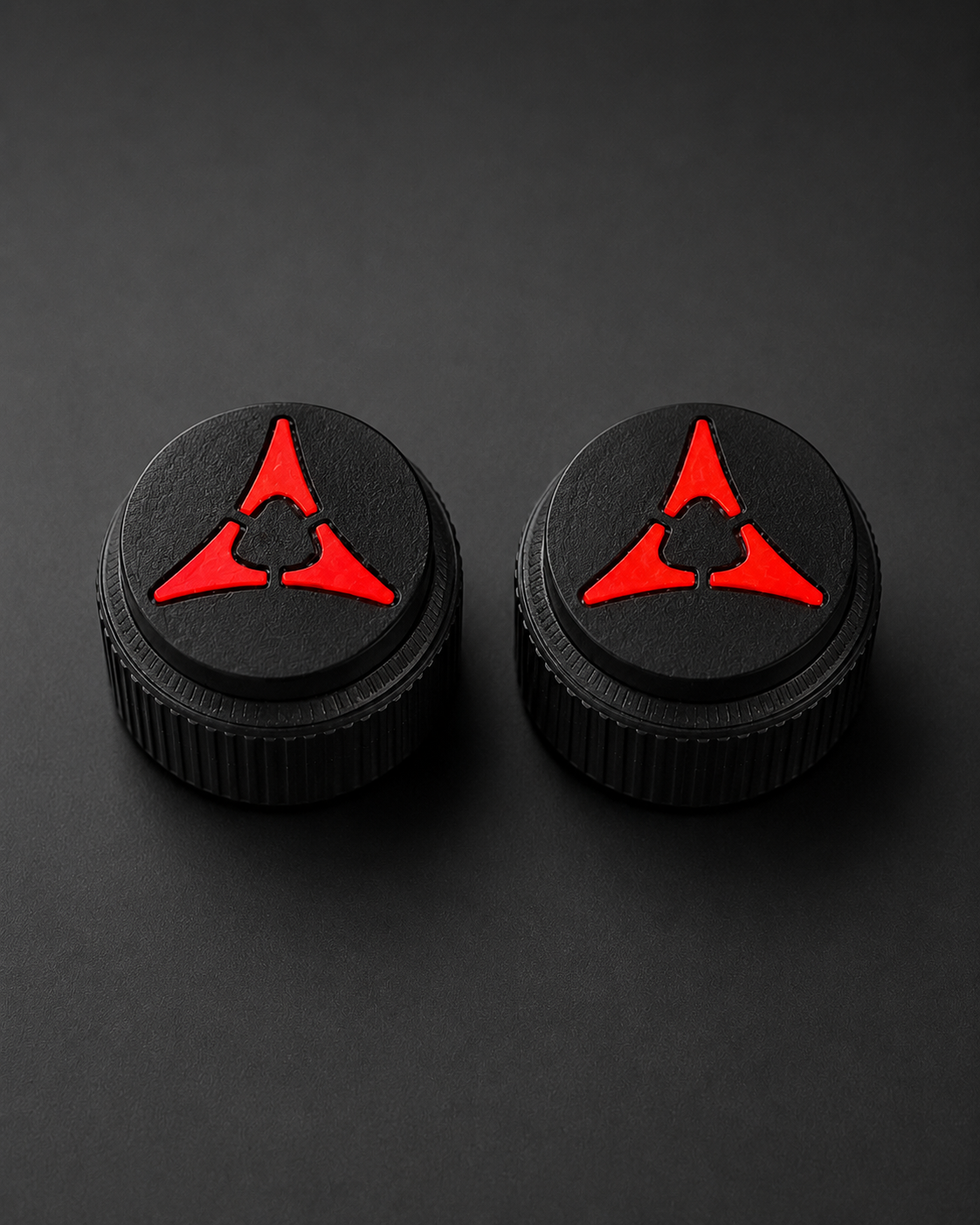 Pair of black Dodge Charger radio knobs with red Fratzog lenses