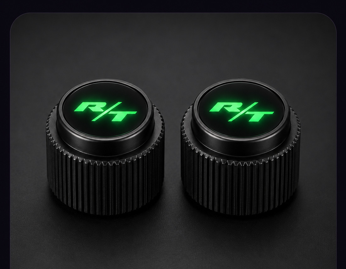 Two black Dodge Charger radio knobs with green LED R/T lenses