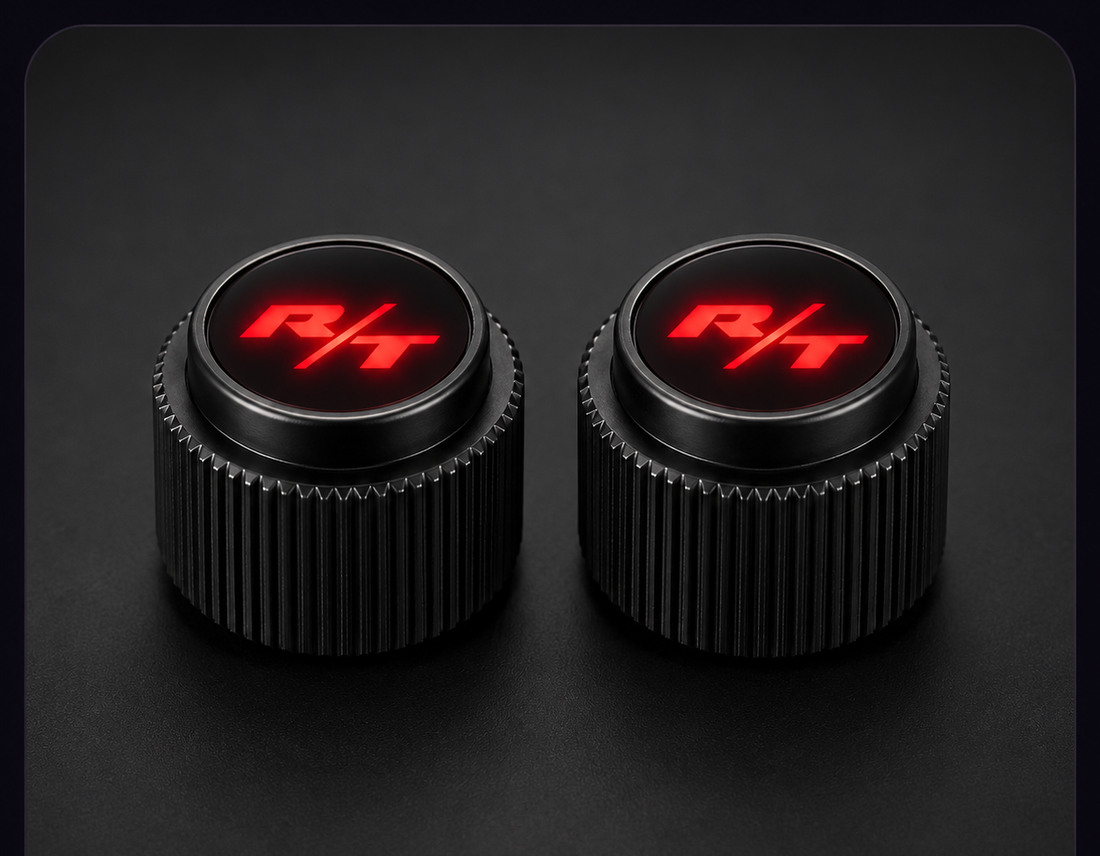 Two black Dodge Charger radio knobs with red LED R/T lenses